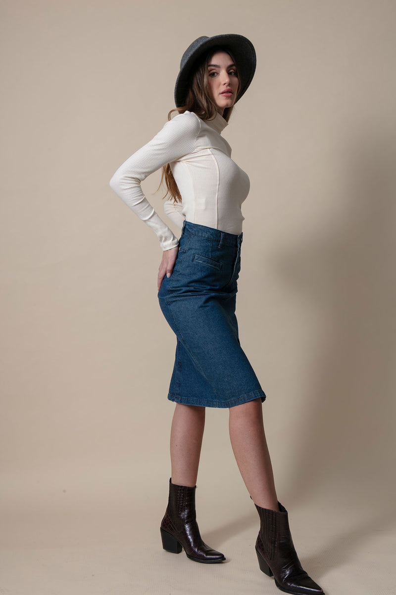 Woman in profile with a short denim skirt in dark blue color